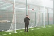 23 January 2011; Match referee Barry Kelly consults, by phone, with local officials at the St Patrick's GAA Club, Ballyragget, Co Kilkenny, before switching the game from the fog covered ground at the Heywood Community Grounds. Walsh Cup, Kilkenny v NUI Galway, Heywood Community School, Balinakill, Co. Laois. Picture credit: Ray McManus / SPORTSFILE