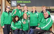 31 January 2011; Ireland's Nadine Lattimore, from Baldoyle, Dublin, Michael McKillop, from Co. Antrim, Orla Barry, from Ladysbridge, Cork, Ailish Dunne, Mountmellick, Co. Laois, Ray O'Dwyer, from Hugginstown, Kilkenny, with in front, Rosemary Tallon, from Drogheda, Co. Louth, Catherine Wayland, from New Ross, Co. Wexford, and Garrett Culliton, from Clonaslee, Co. Laois, on their arrival into Dublin following the 2011 IPC Athletics World Championships in New Zealand. Dublin Airport, Dublin. Picture credit: Ray McManus / SPORTSFILE