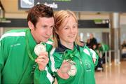 31 January 2011; Ireland's Catherine Wayland, from New Ross, Co. Wexford, who won Gold in the Women's Discus F51 and Silver in the Women's Club Throw with Michael McKillop, from Co. Antrim, who won a Gold Medal after winning the Men's 800m T37 and also won the 1,500m final on their arrival into Dublin following the 2011 IPC Athletics World Championships in New Zealand. Dublin Airport, Dublin. Picture credit: Ray McManus / SPORTSFILE