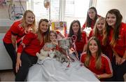 26 September 2016; Ciara Ashman, age 10, and member of Inch Rovers GAA club in Cork, with members of the Cork team with the Brendan Martin cup during a visit to Our Lady's Children's Hospital, Crumlin, in Dublin. Photo by Piaras Ó Mídheach/Sportsfile