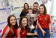 26 September 2016; Ava Finn, from Tubbercurry, in Sligo, on her 4th Birthday, with parents Aoife and David, with Cork players, from left, Orlagh Farmer, Ciara O'Sullivan and Eimear Meaney with the Brendan Martin cup during a visit to Temple Street Children's Hospital, in Dublin. Photo by Piaras Ó Mídheach/Sportsfile