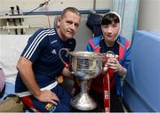 26 September 2016; Rebecca Klein, aged 12, from Tooreen, Ballyhaunis in Mayo, with Cork manager Ephie Fitzgerald and the Brendan Martin cup during a visit to Temple Street Children's Hospital, in Dublin. Photo by Piaras Ó Mídheach/Sportsfile