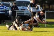 2 February 2011; Tom Austin, Blackrock College, scores a try despite the tackles of David Rigney, left, and Cillian Dempsey, Newbridge College. Powerade Leinster Schools Rugby Senior Cup, First Round, Blackrock College v Newbridge College, St. Mary's RFC, Templeville Road, Templeogue, Dublin. Picture credit: Barry Cregg / SPORTSFILE