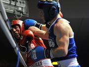 11 February 2011; Gavin Keating, left, St. Saviours Boxing Club, in action against Michael Myers, Ryston Boxing Club, during their 60kg division bout. National Boxing Championships, Preliminaries, National Stadium, Dublin. Picture credit: David Maher / SPORTSFILE