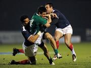 11 February 2011; Tiernan O'Halloran, Ireland, is tackled by Sebastien Vahaamahina, left, and Jean Marc Doussain, France. U20 Six Nations Rugby Championship, Ireland v France, Buccaneers RFC, Athlone, Co. Westmeath. Picture credit: Matt Browne / SPORTSFILE