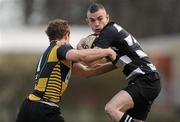 12 February 2011; Eddie Devitt, Old Belvedere, is tackled by Aaron Carroll, Young Munster. Ulster Bank League Division 1A, Old Belvedere v Young Munster, Anglesea Road, Ballsbridge, Dublin. Picture credit: Stephen McCarthy / SPORTSFILE