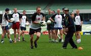 11 October 2001; Ireland's Cormac McAnallen, under the watchful eye of manager Brian McEniff, prepares to shoot during the Irish squad training session in preparation for the Foster's International Rules Series against Australia. MCG, ( Melbourne Cricket Ground ), Melbourne, Australia. Aust2001. Picture credit; Ray McManus / SPORTSFILE *EDI*