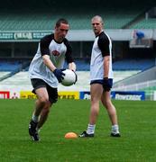 11 October 2001; Ireland's Brendan Devenney, under the watchful eye of team-mate Brendan ger O'Sullivan, prepares to shoot during the Irish squad training session in preparation for the Foster's International Rules Series against Australia. MCG, ( Melbourne Cricket Ground ), Melbourne, Australia. Aust2001. Picture credit; Ray McManus / SPORTSFILE *EDI*