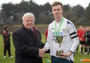 17 February 2011; IUFU Chairman Terry McAuley presents the cup to Dublin City University 'B' captain Garry Donohoe. CUFL Second Division Final, Dublin City University 'B' v Drogheda Institute of FE. Ballymun United FC, Ballymun, Dublin. Photo by Sportsfile