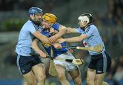 19 February 2011; Pa Bourke, Tipperary, in action against Stephen Hiney, left, and Ruairí Trainor, Dublin. Allianz Hurling League, Division 1 Round 2, Dublin v Tipperary, Croke Park, Dublin. Picture credit: Ray McManus / SPORTSFILE