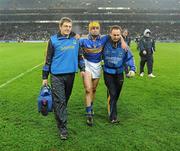 19 February 2011; Shane McGrath, Tipperary, is assisted from the pitch with an injury following the game. Allianz Hurling League, Division 1 Round 2, Dublin v Tipperary, Croke Park, Dublin. Picture credit: Stephen McCarthy / SPORTSFILE