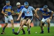 19 February 2011; Joe Boland, Dublin, under pressure from Tipperary players Eoin Kelly, right, James Woodlock, left and Patrick Maher. Allianz Hurling League, Division 1 Round 2, Dublin v Tipperary, Croke Park, Dublin. Picture credit: Ray McManus / SPORTSFILE