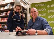 8 October 2016; Retired Ireland captain and Munster Rugby legend Paul O'Connell signs a copy of his new book 'The Battle' for Chloe Hall Molloy, aged 16, from Wexford at Easons in Dublin City Centre.  Photo by David Fitzgerald/Sportsfile