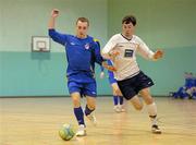 1 March 2011; Greg Leahy, Drogheda Institute of Further Education, in action against Anthony Costigan, DCU. Colleges and Universities Futsal National Cup Finals, Group One, Gormanston College, Gormanston, Co. Meath. Photo by Sportsfile