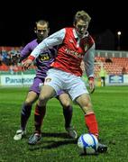 1 March 2011; David McMillan, St Patrick's Athletic, in action against Tony Kane, Cliftonville. Setanta Sports Cup, First Round, Second Leg, St Patrick's Athletic v Cliftonville, Richmond Park, Dublin. Picture credit: David Maher / SPORTSFILE