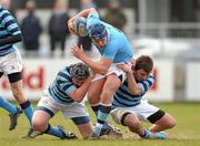 10 March 2011; James Bollard, St. Michael's College, is tackled by Zaran Butt and Ryan Murrells, right, Castleknock College. Powerade Schools Junior Cup 2nd Round, St. Michael's College v Castleknock College, Donnybrook Stadium, Donnybrook, Dublin. Photo by Sportsfile