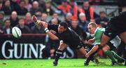 17 November 2001; Byron Kelleher of New Zealand in action against Peter Stringer of Ireland during the International Friendly match between Ireland and New Zealand at Lansdowne Road in Dublin. Photo by Brendan Moran/Sportsfile