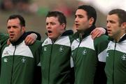 11 November 2001; Irish players, from left, Mike Mullins, Brian O'Driscoll, Jeremy Staunton and Kevin Maggs, sing the National Anthem ahead of the International Rugby match between Ireland and Samoa at Lansdowne Road in Dublin. Photo by Brian Lawless/Sportsfile