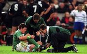 17 November 2001; Shane Horgan of Ireland is attended to by Ailbe McCormack, Ireland Team Physio, right, and Dr. Michael Griffen, during the International Friendly match between Ireland and New Zealand at Lansdowne Road in Dublin. Photo by Matt Browne/Sportsfile