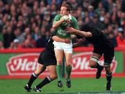 17 November 2001; Denis Hickie of Ireland in action against Aaron Mauger, right, and Norm Maxwell, both of New Zealand, during the International Friendly match between Ireland and New Zealand at Lansdowne Road in Dublin. Photo by Matt Browne/Sportsfile