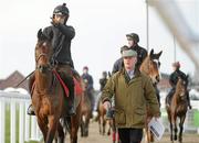 14 March 2011; Trainer Willie Mullins with Hurricane Fly and jockey Ruby Walsh lead out the runners and riders from his yard in Closutton, Bagnelstown, Co. Carlow, ahead of the Cheltenham Racing Festival 2011 which takes place from the 15th-18th March. Prestbury Park, Cheltenham, England. Picture credit: Matt Browne / SPORTSFILE