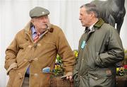 16 March 2011; Punters Vincent Quinn, left, from Ennis, Co. Clare, and Philip McCarthy, from Athy, Co. Kildare, discuss todays card before the days racing begins. Cheltenham Racing Festival 2011, Prestbury Park, Cheltenham, England. Picture credit: Barry Cregg / SPORTSFILE