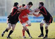 16 March 2011; Peter O'Mahony, Munster A, is tackled by John Burns and Thomas Anderson, Ulster Ravens. Interprovincial fixture, Ulster Ravens v Munster A, Shaw's Bridge, Belfast, Co. Antrim. Picture credit: Oliver McVeigh / SPORTSFILE