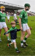 30 October 2016; Henry Shefflin of Ballyhale Shamrocks and his son Henry jnr in the parade prior to the Kilkenny County Senior Club Hurling Championship Final game between Ballyhale Shamrocks and O'Loughlin Gaels at Nowlan Park in Kilkenny. Photo by Piaras Ó Mídheach/Sportsfile