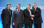 16 March 2011; John Joe Brady, Mullahoran, Co. Cavan, is presented with his GAA President's Award for 2011 by Uachtarán Cumann Lúthchleas Gael Criostóir Ó Cuana, in the company of AIB Bank General Manager Billy Finn, left, and Pól Ó Gallchóir, Ceannaái TG4. John Joe Brady’s association with Ladies Football goes back to 1976 and he has held practically all the positions of administration and management of football teams. John Joe was the first Chairman of the Mullahoran Club in the years 1975 and 1982 and from 1995 to ‘99. He helped bring the Mullahoran Ladies to the top of the ladder in 1977 when they won the first ever All-Ireland Club final. GAA President's Awards 2011, Croke Park, Dublin. Picture credit: Brian Lawless / SPORTSFILE