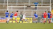 17 March 2011; Harry Og Conlon, St Patrick's Academy, Dungannon, scores his side's first goal against Matthew McNeice, St Colman's, Newry. BT MacRory Cup Final 2011, St Colman's, Newry v St Patrick's Academy, Athletic Grounds, Armagh. Picture credit: Oliver McVeigh / SPORTSFILE