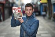 3 November 2016; Robert Heffernan poses with a copy of his book 'Walking Tall' at Princes Street in Cork. Photo by Stephen McCarthy/Sportsfile