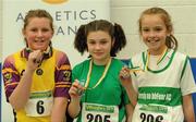 19 March 2011; Competitors, from left to right, Marguerite Furlong, Adamstown, 2nd place, Vickie Cusack, Liscarroll, 1st place, and Arianne O'Flynn, Carraig-Na-Bhfear, 3rd place, with their medals after the U12 Girls Shot Putt. Woodie’s DIY National Juvenile Indoor Championships, Meadowbank Indoor Arena, Magherafelt, Derry. Picture credit: Oliver McVeigh / SPORTSFILE