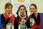 19 March 2011; Competitors, from left to right, Kate O'Connor, St Gerards, 2nd place, Sophie Lynch, Lios Tuathail, 1st place, and Susan O'Neill, Dooneen, 3rd place, with their medals after the U12 Girls 600m. Woodie’s DIY National Juvenile Indoor Championships, Meadowbank Indoor Arena, Magherafelt, Derry. Picture credit: Oliver McVeigh / SPORTSFILE