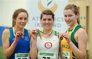 19 March 2011; U18 Girls 1500m winner Emily Miler, St Coca's, Co. Kildare, centre, with second place Siobhan McGinleym, Celtic DCH, Dublin, left, and third place Eadaoin O'Reilly, Annalee AC, Co.Cavan. Woodie’s DIY National Juvenile Indoor Championships, Meadowbank Indoor Arena, Magherafelt, Derry. Picture credit: Oliver McVeigh / SPORTSFILE
