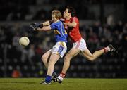23 March 2011; Michael O'Dwyer, Tipperary, in action against Liam Jennings, Cork. Cadbury Munster GAA Football Under 21 Championship Semi-Final, Cork v Tipperary, Pairc Ui Rinn, Cork. Picture credit: Stephen McCarthy / SPORTSFILE