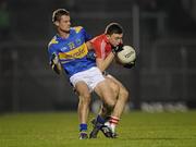 23 March 2011; Mark Collins, Cork, in action against Alan Maloney, Tipperary. Cadbury Munster GAA Football Under 21 Championship Semi-Final, Cork v Tipperary, Pairc Ui Rinn, Cork. Picture credit: Stephen McCarthy / SPORTSFILE