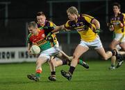 23 March 2011; Ritchie Mahon, Carlow, in action against Emmet Kent and Killian Kehoe, 14, Wexford. Cadbury Leinster GAA Football Under 21 Championship Semi-Final, Carlow v Wexford, O'Moore Park, Portlaoise, Co. Laois. Picture credit: Matt Browne / SPORTSFILE