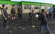 10 November 2016; AIG Insurance facilitated a visit by the Maori All Blacks, Dublin GAA players and Limerick GAA coaches to Scoil Chríost Rí, Caherdavin in Limerick ahead of their match against Munster on Friday. In attendance at the event are members of the Maori All Blacks, from left, Ihaia West, Otere Black, and James Lowe, being shown the skills of gaelic football by Scoil Chríost Rí student Michael Dike.   Photo by Brendan Moran/Sportsfile