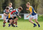 31 March 2011; James Glenn-Craigie, St. Columba's, with support from team-mate Dudley Browne, is tackled by Brian Heveran, left, and Ryan Casey, right, CBS Naas. Senior Shield Section 'A' Final, CBS Naas v St. Columba's, North Kildare RFC, Kilcock, Co. Kildare. Picture credit: Barry Cregg / SPORTSFILE