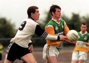 2 August 1998; Gary Comerford of Offaly is tackled by Rory Brennan of Sligo during the All-Ireland Junior Football Championship Semi-Final between Offaly and Sligo at Dr Hyde Park in Roscommon. Photo by Matt Browne/Sportsfile