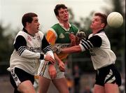 2 August 1998; Gary Comerford of Offaly is tackled by Rory Brennan and Trevor McGuinn, right, of Sligo during the All-Ireland Junior Football Championship Semi-Final between Offaly and Sligo at Dr Hyde Park in Roscommon. Photo by Matt Browne/Sportsfile