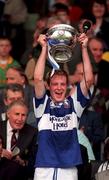 2 August 1998; Laois captain John Behan lifts the cup following the Leinster Minor Football Championship Final match between Laois and Dublin at Croke Park in Dublin. Photo by Ray McManus/Sportsfile