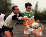 2 August 1998; John Hurst of Offaly is tackled by Peter Mullan  of Sligo during the All-Ireland Junior Football Championship Semi-Final between Offaly and Sligo at Dr Hyde Park in Roscommon. Photo by Matt Browne/Sportsfile