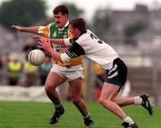 2 August 1998; Mel Keeneghan of Offaly is tackled by Jimmy Hayes of Sligo during the All-Ireland Junior Football Championship Semi-Final between Offaly and Sligo at Dr Hyde Park in Roscommon. Photo by Matt Browne/Sportsfile