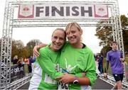 13 November 2016; Julie Halton, left, and Joy Tegart, from Drogheda, finish the Remembrance Run 2016 at Phoenix Park in Dublin. Photo by Cody Glenn/Sportsfile