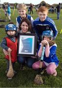 14 November 2016; ESB, Official Energy Partner to the GAA, presents Kevin's Hurling and Camogie Club in Dublin with a cheque for Ä1,500. The prize is part of ESBís GAA Fund whereby ESB staff members nominated a local GAA club that is making a difference in the community. Over the coming weeks, a grand total of Ä30,000 will be awarded to 18 GAA clubs across the country.  Pictured at the presentation are Louise Davis, ESB staff member, with Kevin's Hurling and Camogie Club players Oliver Davey, back left, 12 years, Dean McKeever, 13, back right, TJ Mannion, 2, left, and Emma Chambers, 7, at the Club's playing grounds, Dolphin Park, Crumlin Road, Dublin. Photo by Ray McManus/Sportsfile