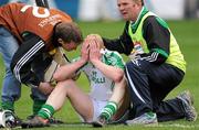 17 March 2011; Seamie Cummins is comforted by his O’Loughlin Gaels club mates after the game. AIB GAA Hurling All-Ireland Senior Club Championship Final, Clarinbridge v O’Loughlin Gaels, Croke Park, Dublin. Picture credit: Ray McManus / SPORTSFILE