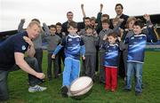 6 April 2011; Leinster rugby players, Leo Cullen, left, Kevin McLaughlin, right, Shane Jennings, and budding rugby stars, from St. Conleth's College, cheer on Will Brosnan, age 8, from Milltown, Dublin, as he practices his kicking, at the launch of the Volkswagen Leinster Rugby Summer Camps 2011. Leinster Rugby Summer Camps Announcement, Donnybrook Stadium, Donnybrook, Dublin. Picture credit: Brian Lawless / SPORTSFILE