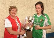 9 April 2011; Carragh Ruitleis, captain of Colaiste Íosagáin, Stillorgan, accepts the cup from Ita Hannon, assistant secetary Cumann Peil Gael na mBan. Tesco All Ireland Ladies Football Post Primary Senior B Championship Final, Holy Rosary, Mountbellew, Co. Galway v Colaiste Íosagáin, Stillorgan, Co. Dublin, Clan na nGael, Johnstown, Athlone, Co. Roscommon. Photo by Sportsfile