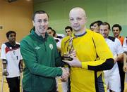 9 April 2011; Liam McGroarty, from the FAI, presents the player of the match trophy to the Blue Magic goalkeeper Rafal Wirkus. FAI Futsal Cup Final, EID Futsal v Blue Magic,  Gormanston College, Gormanston, Co. Meath. Picture credit: Matt Browne / SPORTSFILE